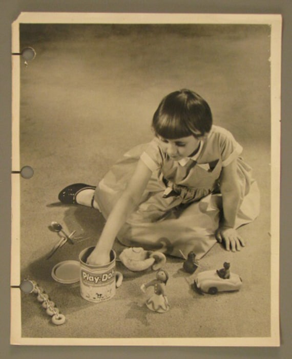 Photograph of girl playing with Play-Doh, ca. 1957, The Strong, Rochester, New York.