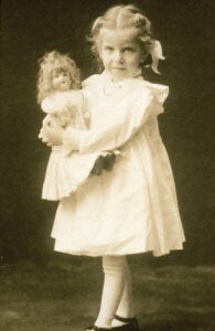 Margaret Strong as child holding doll Mabel