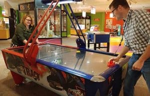 Archivists playing air hockey, 2016. Courtesy of Julia Novakovic.