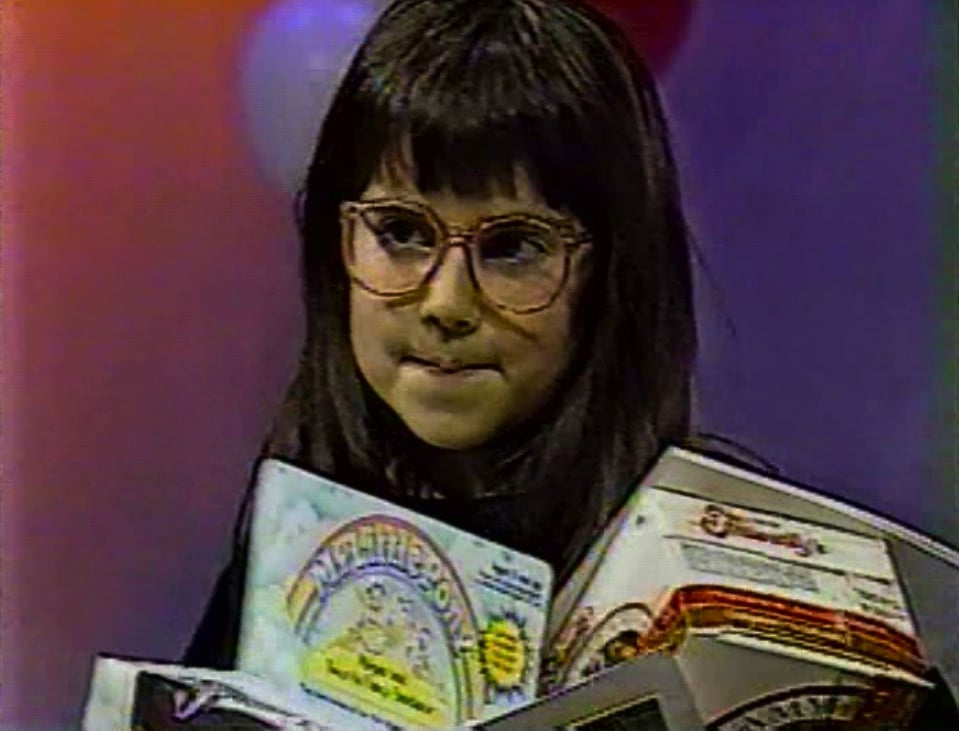 Still from The Bozo Show, 1990, courtesy of Lauren Sodano. Lauren contemplates her next conquest.