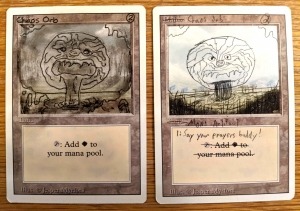 Two hand-drawn versions of the Magic: The Gathering card, Chaos Orb, from the personal collection of game designer Arnold Hendrick; The Strong, Rochester, New York.