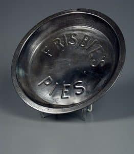 Frisbie's Pies, pie pan, about 1950. The Strong, Rochester, New York.As the story goes, employees at the Frisbie Pie Company of Bridgeport, Connecticut, eagerly anticipated their lunch breaks, when they could indulge in tossing the pie tins back and forth in the parking lot. So many pans were flung into the Pequonnock River near the bakery that owner Joseph P. Frisbie began to require deposits on his tins to ensure they made their way back into the plant for re-use.