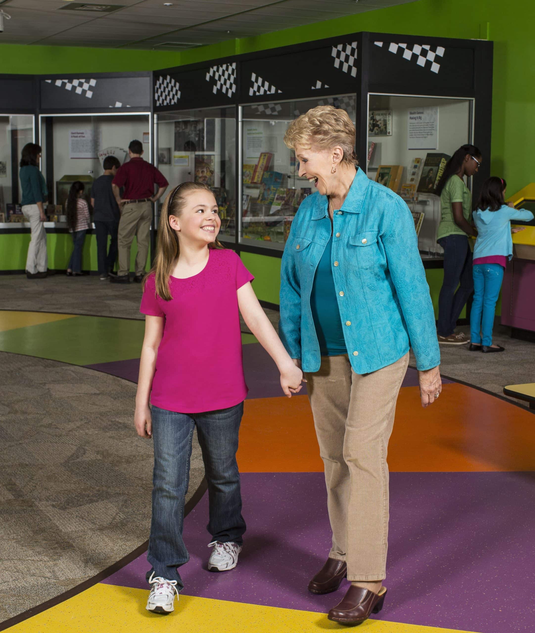 Grandmother and child in Game Time exhibit