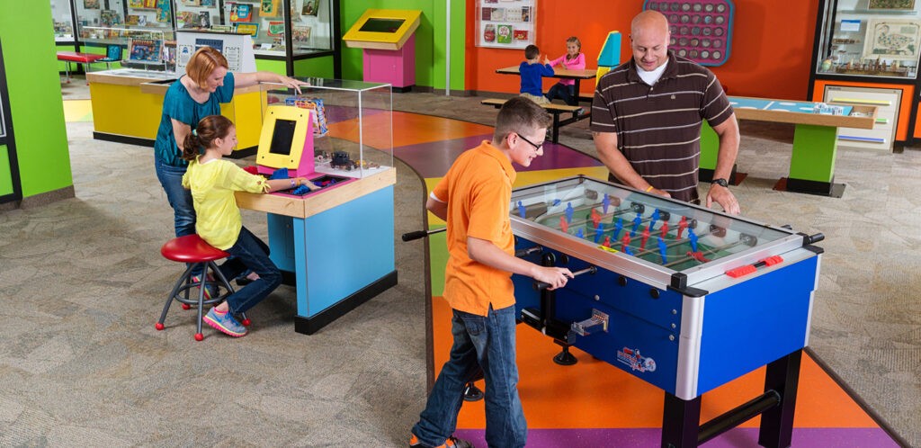 Dad and son playing foosball