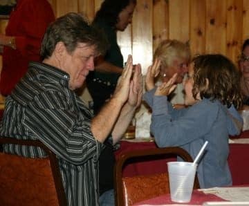 Mom’s family celebrated her birthday with lots of merriment, music, laughter, and games. Young Leah, another great granddaughter, teaches Uncle Charlie how to play without toys.