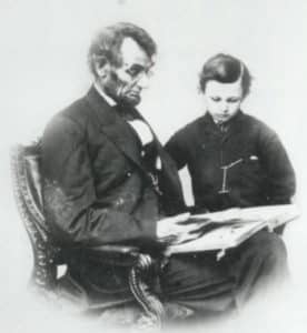 Lincoln reading to Tad, Feb. 1865, Courtesy of Creative Commons