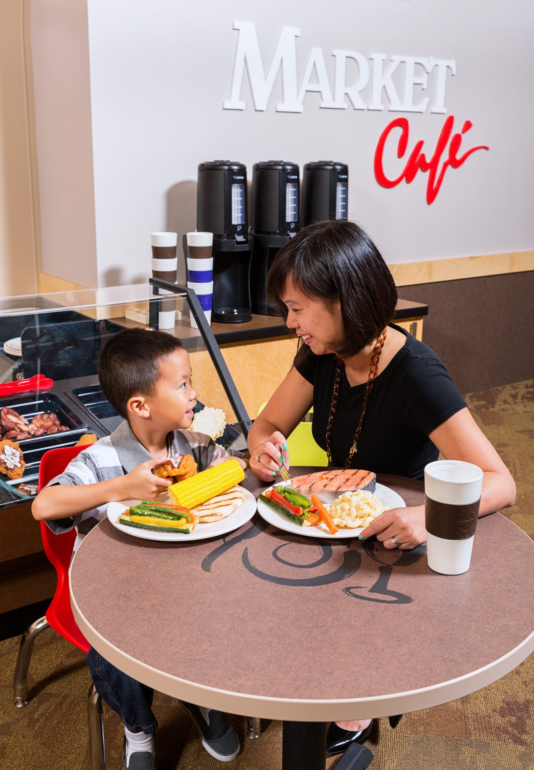 Mom and child at market cafe