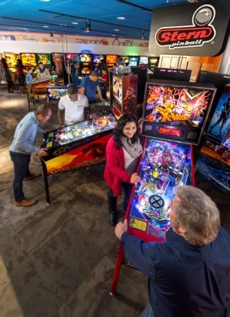 Guests playing pinball