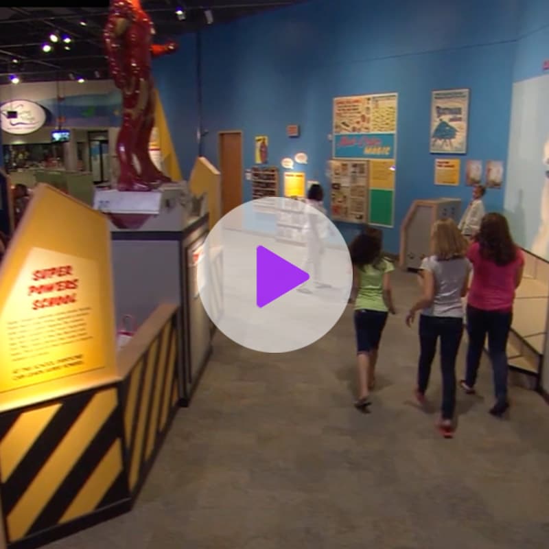 Screen shot of comic book heroes exhibit video