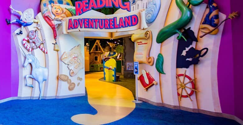 Reading Adventureland entrance as large pop up book