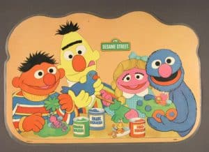 Ernie, Bert, Prairie Dawn, and Grover bond over National Toy Hall of Fame inductee Play-Doh. Sesame Street place mat, about 1992, gift of William J. Tribelhorn, courtesy of The Strong, Rochester, New York.