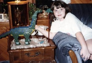 Young Bethany with constructed Mega Bloks Dinobloks Brontosaurus, courtesy Bethany Mosher, Rochester, New York