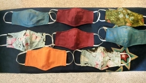 Cataloger Lindsey Barnick put her fabric scrap stash and her skills to work to make cloth masks for friends and family members.Photo courtesy of Lindsey Barnick.