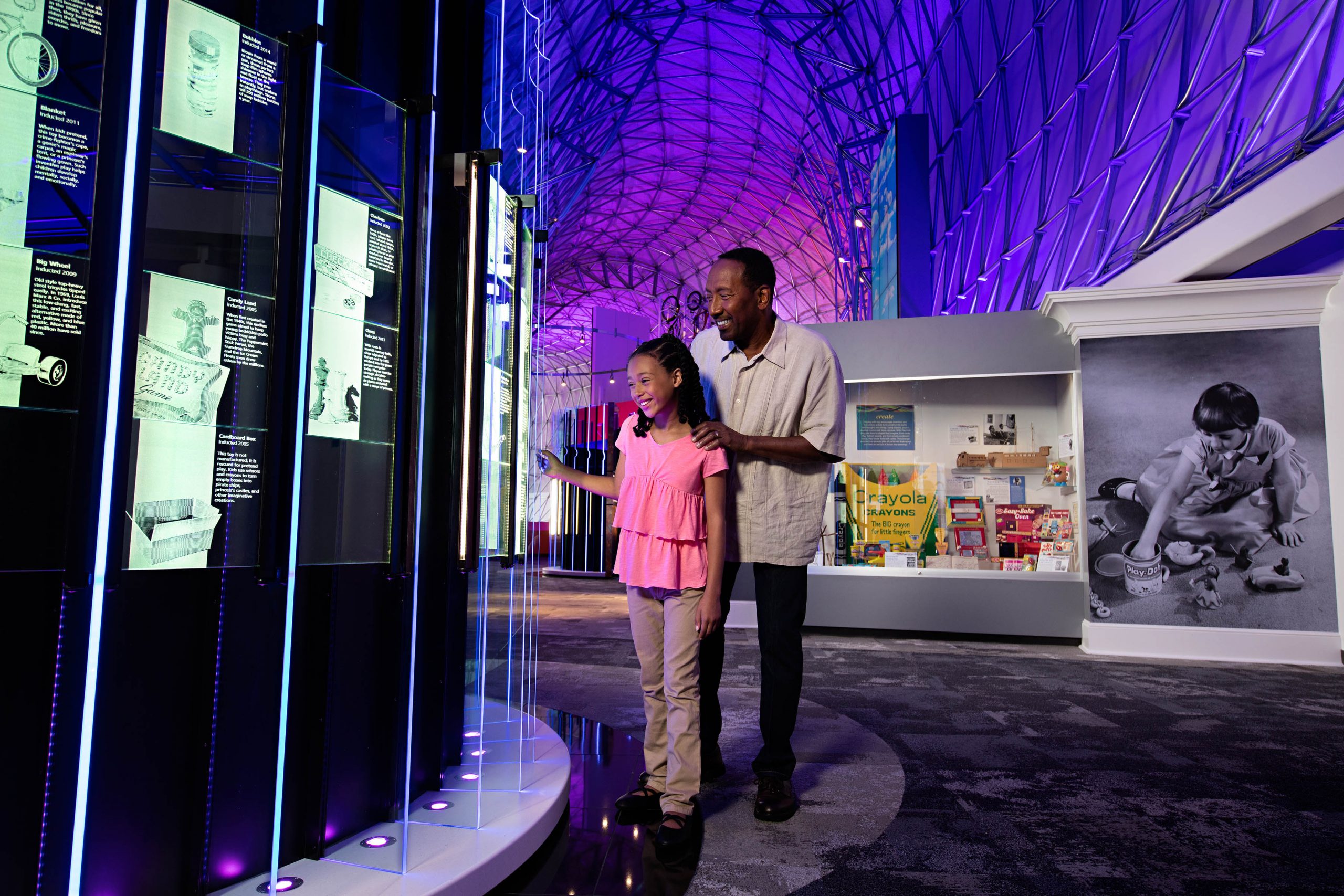 Dad and daughter in Toy Halls of Fame