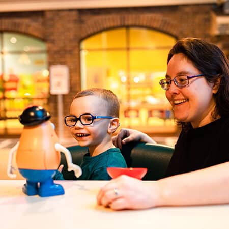 Mom and son playing mr potato head