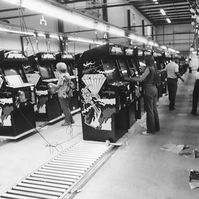 Women testing Williams arcade games
