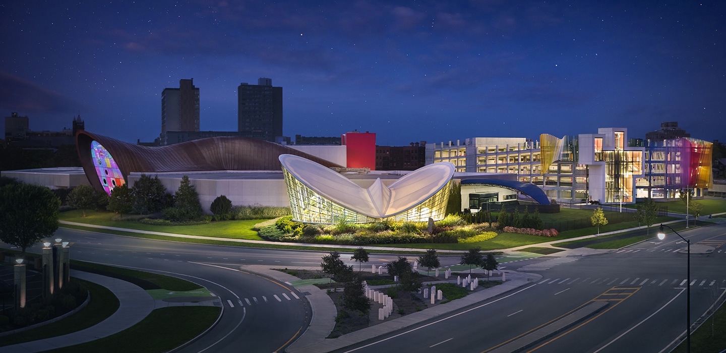 Night photo of museum and parking garage