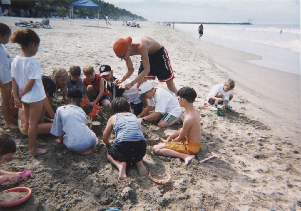 Photo of children building a sandcastle, about 1980. The Strong, Rochester, New York.