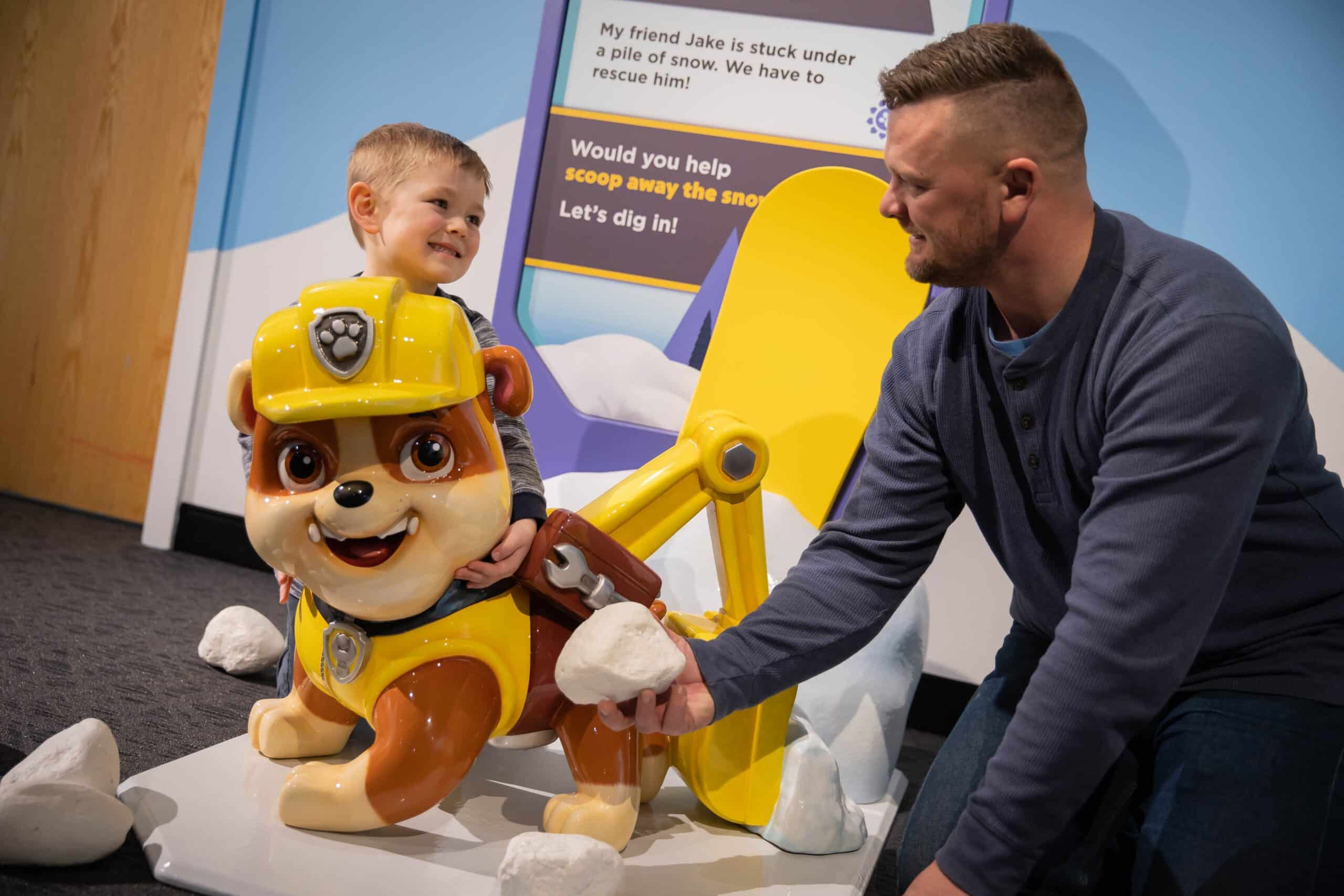 Family playing in the PAW Patrol: Adventure Play exhibit