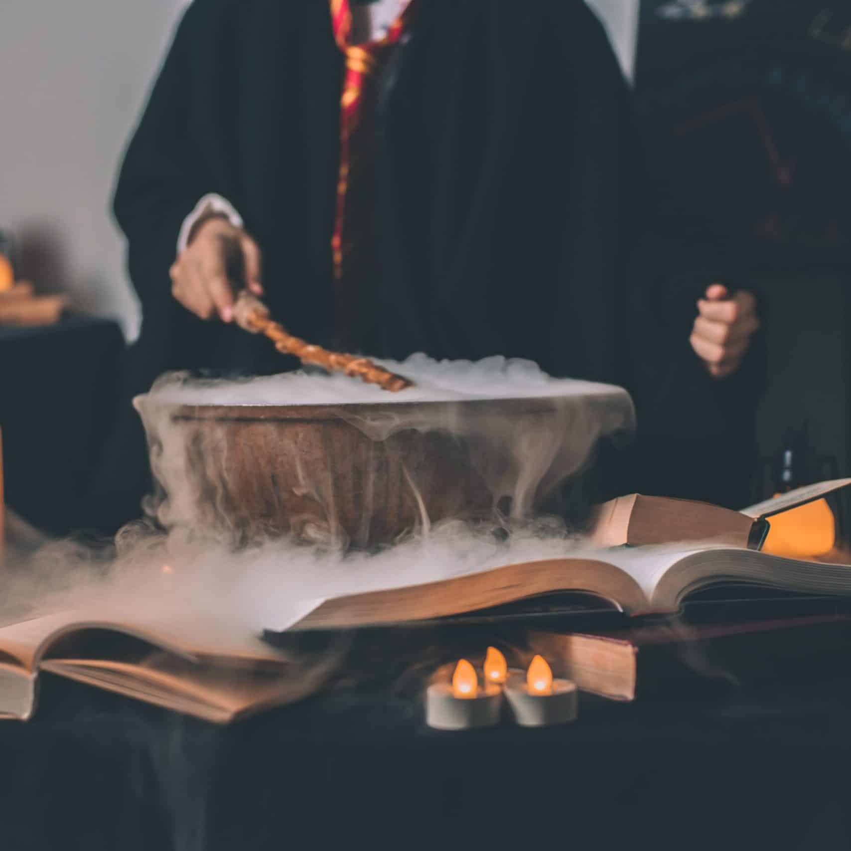 Spooky scene filled with magic potions, candles and spellbook