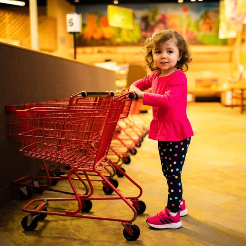 Child playing in Wegmans Super Kid Market