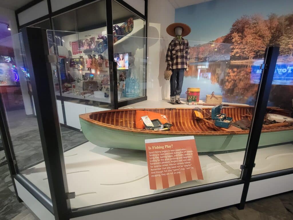 Penn Yan Car Top fishing boat and fishing equipment on display in The Strong’s America at Play exhibit, 2022. The Strong, Rochester, New York