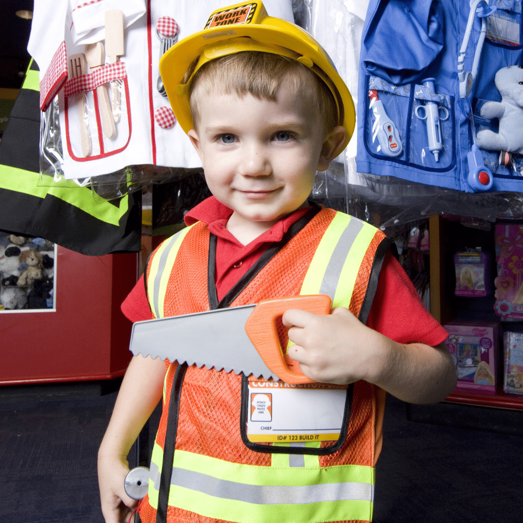 Little boy dressed up as a construction worker.