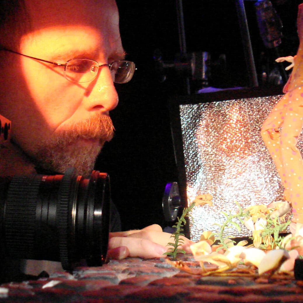 Tom Gasek using his camera to capture clay figure..