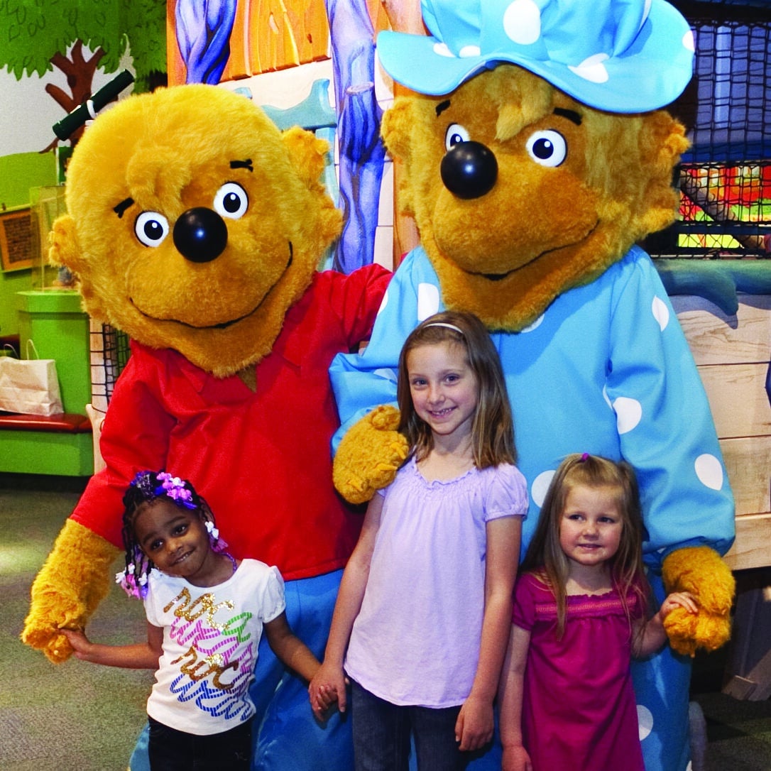 3 children posing with 2 berenstain bears