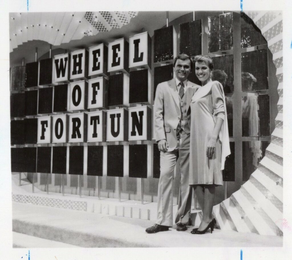 Pat Sajak and Vanna White on the set of Wheel of Fortune in the 1980s