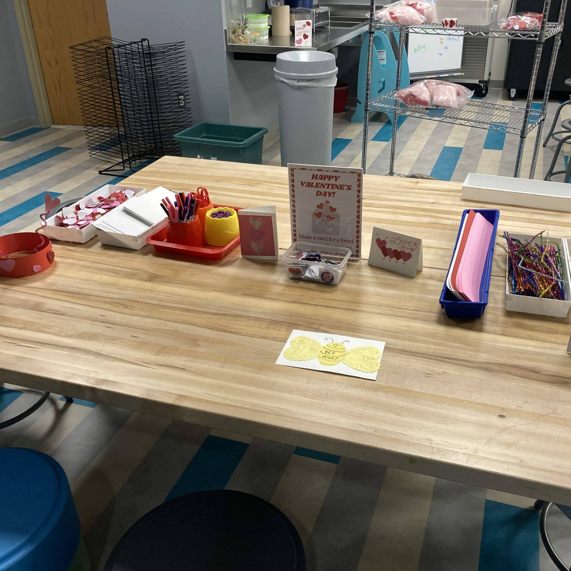 Craft table with valentine's card-making supplies