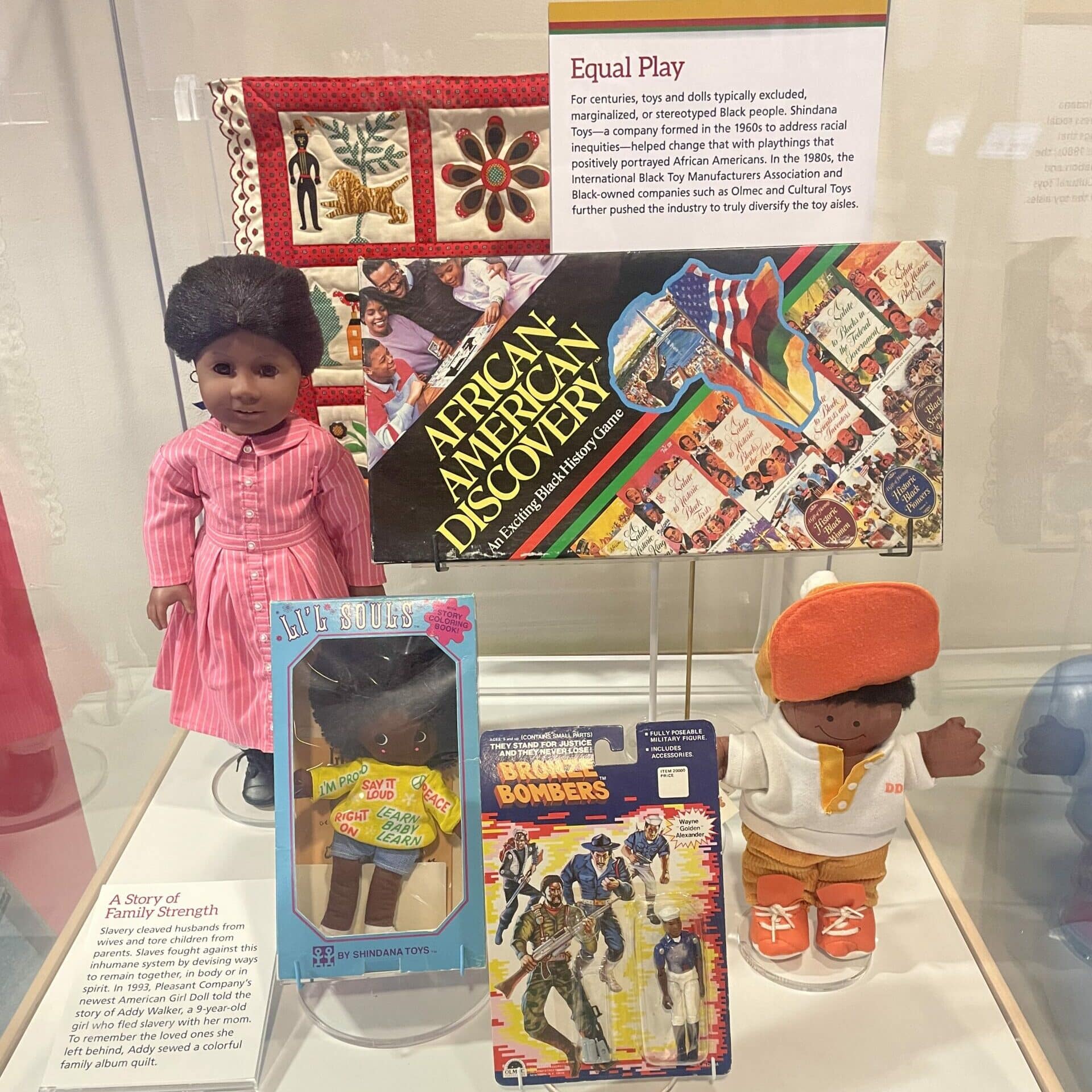 A museum display case showing artifacts related to black history month.