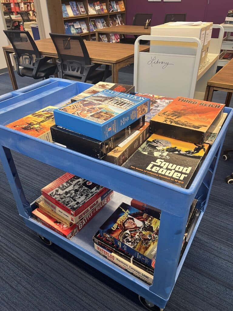 Image of Cart of games ready for study in the Brian Sutton-Smith Library and Archives at The Strong National Museum of Play, 2024.