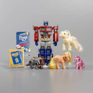 Left to right, Phase 10, Transformers, and three My Little Ponies