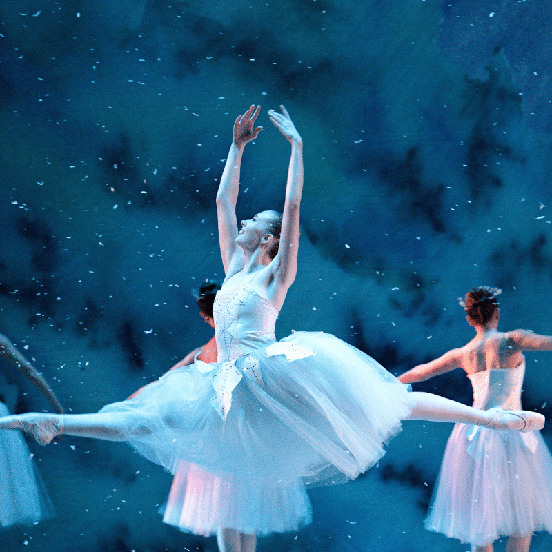 Dancer on stage leaping.