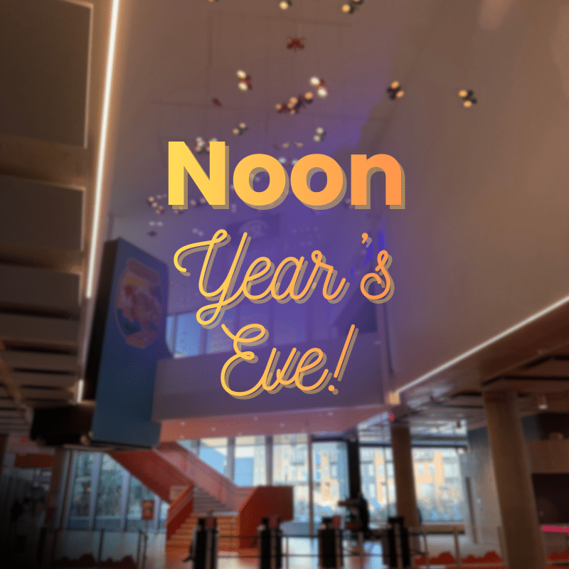Photo of The Strong's Wilson Admissions Lobby with overlayed text that reads, "Noon Year's Eve"