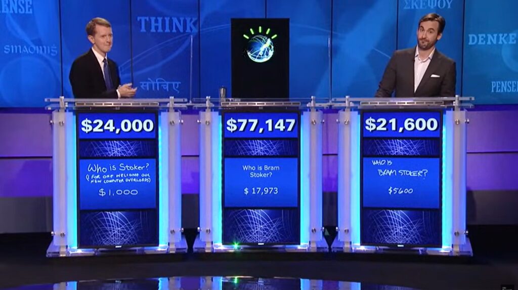 Waston computer at the middle podium with a winning score of $77,000 displayed 