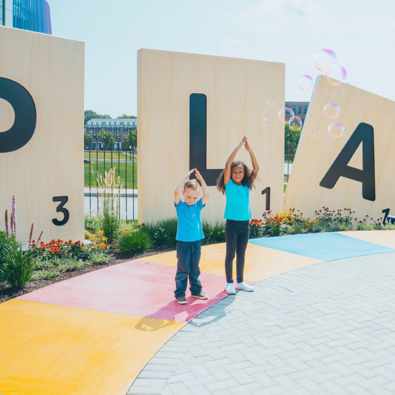 two kids posing in Hasbro Game Park