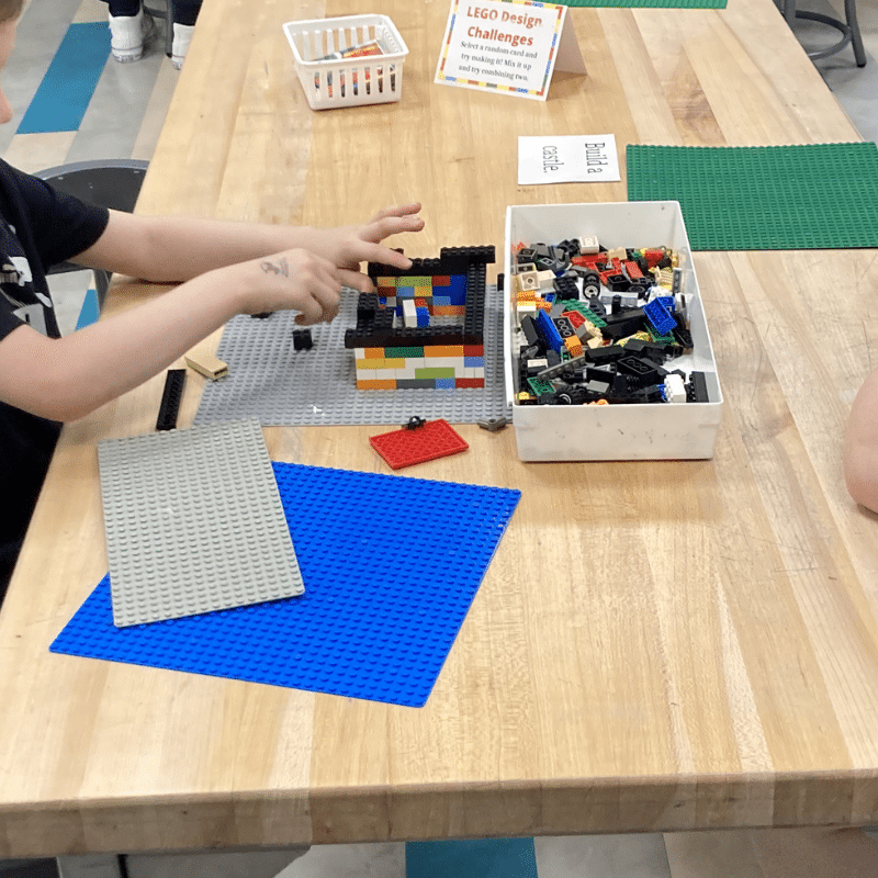 Boy playing with LEGOs in the Play Lab