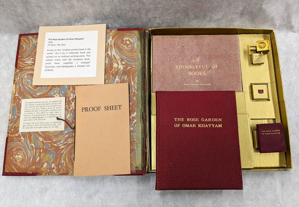 Image of the box of different sizes of The Rose Garden, 1932, The Strong National Museum of Play, Rochester, New York. The tiny red square on the right side is the “smallest printed book” when it was made in 1932.