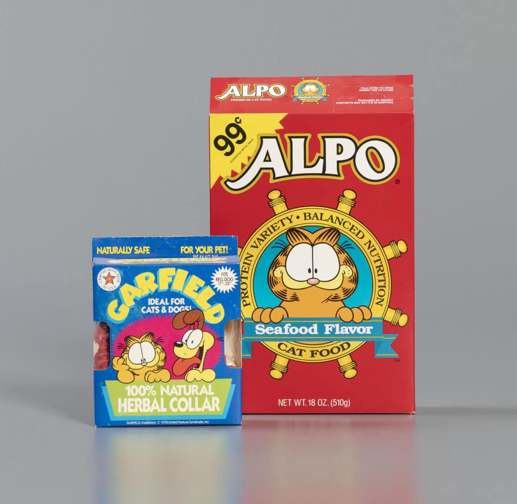 Left to right: Garfield 100% Natural Herbal Collar, 1993. Alpo Seafood Flavor Cat Food, 1993, The Strong National Museum of Play, Rochester, NY.