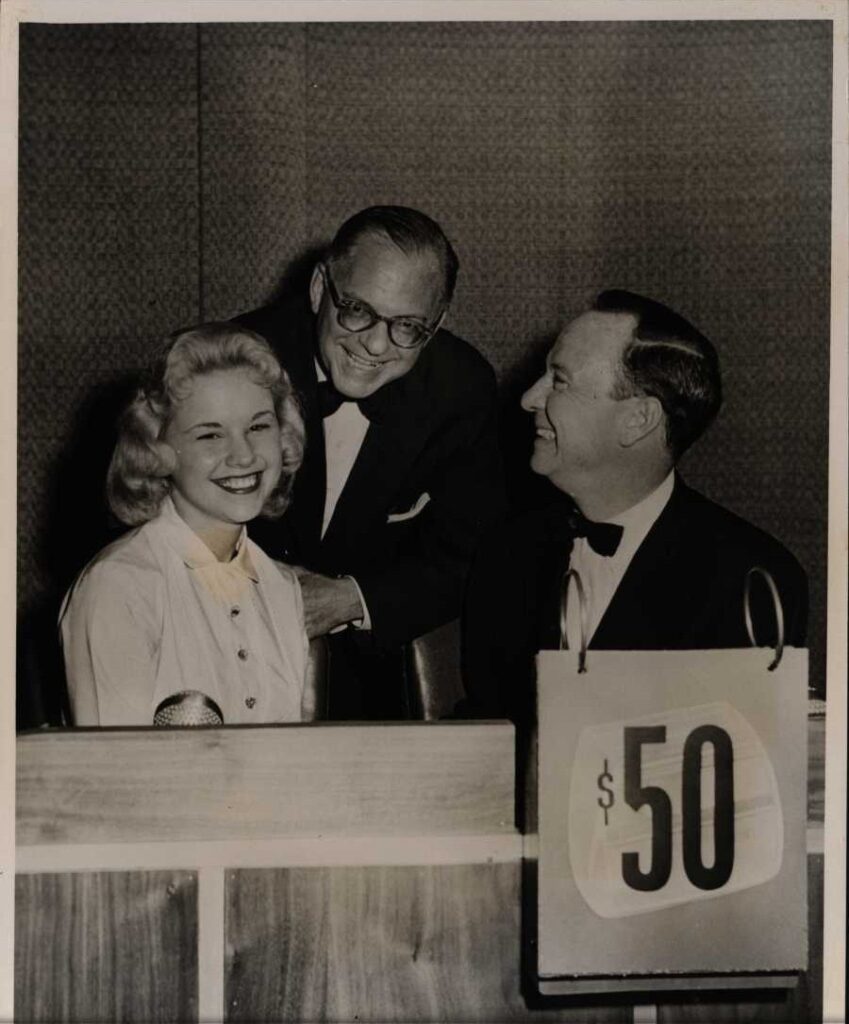 Candy Lee on set with Bennett Cerf and John Daly. Candy Lee papers, The Brian Sutton-Smith Library and Archives of Play at The Strong National Museum of Play, Rochester, New York.