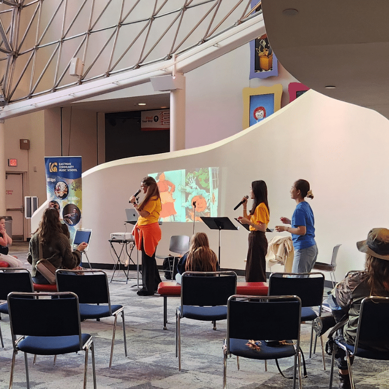 Guests listening to an early-childhood music performance