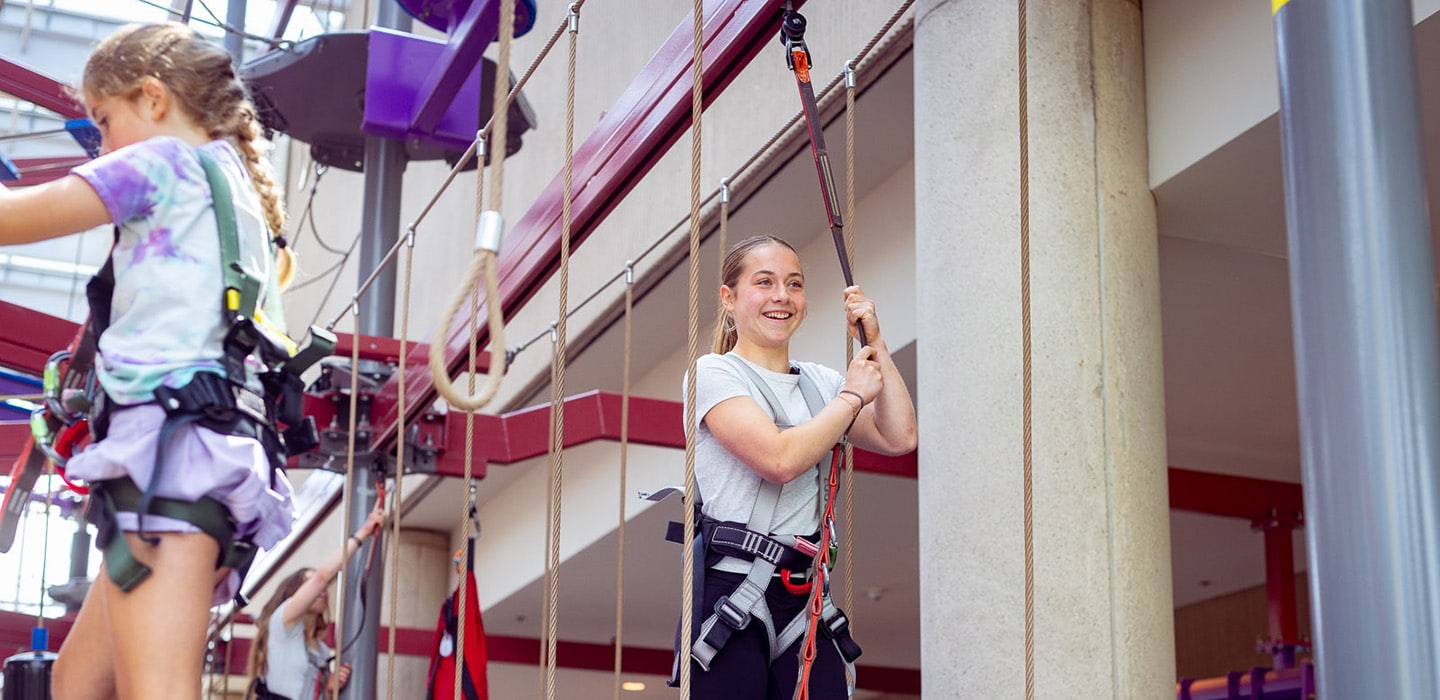 Girls using ropes course