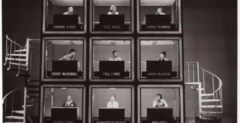 Nine Hollywood Square panels filled with celebrities, including Ed Asner