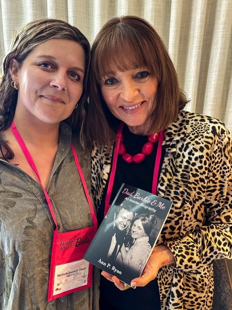 Michelle and Ann P. Ryan with a Copy of Dad, Barbie & Me: An Insider’s Biography, 2026. Courtesy of the author.
