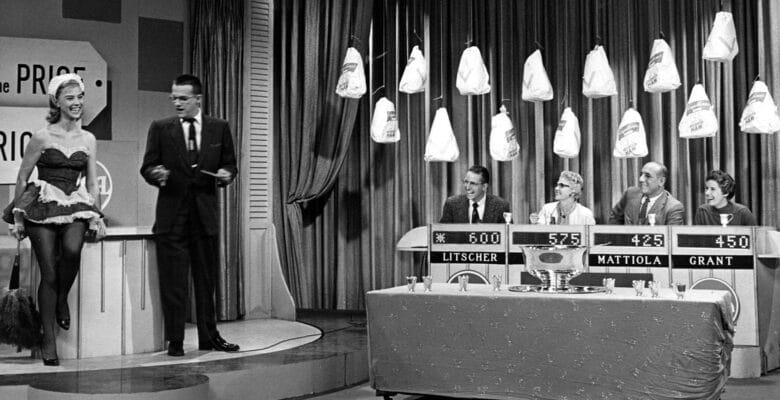 Contestants laughing at host Bill Cullen as he jokes with Price is Right model
